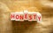 Honesty symbol. The concept word Honesty on wooden blocks. Beautiful canvas background, copy space. Business and honesty concept
