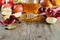 Honey, apple, pomegranate and bread hala, table set with traditional food for Jewish New Year Holiday, Rosh Hashana