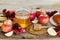 Honey, apple, pomegranate and bread hala, table set with traditional food for Jewish New Year Holiday, Rosh Hashana