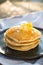 Honey being pour onto stack of pancake