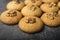 Honey biscuits with a kernel of walnut. Dark background