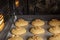 Honey biscuits with walnuts in oven on a baking sheet with parchment paper, ready for baking