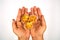 Honey cornflakes on top of hand over white background