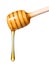 Honey dripping from wooden honey dipper