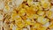 Honey flows on corn flakes cereal breakfast close up. Natural immunity products