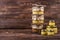 Honey in a glass jar on a dark wooden background