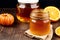 Honey in a glass jar on a wooden background. Selective focus. healthy food concept. Generative AI