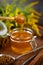 Honey in a glass jar with a wooden spoon. Still life on a wooden table with yellow flowers Goldenrod. Healthy sweet food. Close up