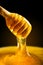 Honey with gold color flows down from a spoon. Healthy food concept. Healthy eating. Diet. Selective focus. Macro.