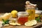 Honey jar with ginger and lemon on a wooden table