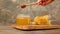 Honey in a jar and honeycomb on old wooden background.