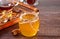 Honey in jar and honeycomb in small bowls. Teapot and cup of tea on the background.