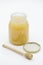 Honey jar and wooden honey spoon