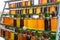 Honey in jars of different colors. Sale of products in the apiary. Close-up, selective focus