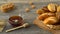 Honey, milk, cookies, and fresh bread on a rustic wooden table. Countryside breakfast.