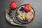 Honey, pomegranate, apples and shofar on black table, flat lay. Rosh Hashana holiday