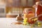 Honey pots honeycomb and bee pollen on white kitchen table