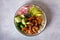 Honey soy shrimp rice bowl with spinach, radish cucumber, seaweed and avocado.