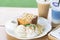 Honey toast dessert with ice coffee and butterfly pea milk on wood table, top view