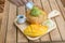 Honey toast green tea ice-cream with ripe barracuda mango and whipping cream in wooden plate on wooden table.