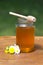 Honey with wooden wand
