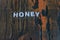 Honey written in white lettering