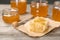 Honeycomb, dipper and jars on table