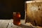 Honeycomb with fresh honey in a vase on wooden table.