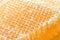 Honeycomb with honey macro background