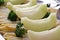 Honeydew melons and asparagus beautifully presented on a tray