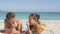 Honeymoon beach couple and sunscreen suntan lotion