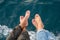 Honeymoon couple barefoot on the boat