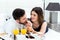 Honeymoon couple having breakfast in hotel room.