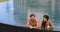 Honeymoon couple relaxing together - swimming pool