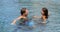 Honeymoon couple relaxing together - swimming pool