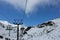 Honeymoon couple traveling in a cable car enjoying the scenic beauty of the snow valley