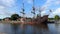 Honfleur, France - July 28, 2021: Reveal shot of the medieval Spanish galley El Galeon, anchored at the port of Honfleur in