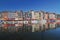 Honfleur harbour in Normandy France. Color houses and their reflection in water