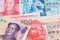 Hong Kong Dollar and China Renminbi Yuan currency banknotes. HKD CNY