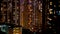 Hong Kong residense building windows illuminate at night. Abstract property price rising