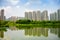 Hong Kong Wetlands Park in Yuen Long, Tin Shui Wai. Tranquil scene with high rise apartments reflected in water