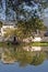 Hongcun Ancient Town in Anhui Province, China. Old building with its reflection in Nanhu Lake