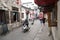 Hongcun Village, China - NOVEMBER 8 2019: Touristic colorful streets of chinese Hongcun Village, locals and tourists walking along