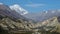 Hongde airport , limestone cliffs and snow capped Tilicho Peak