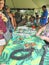 Honolulu, Hawaii - 5/2/2018 - Tourists learning the fine art of lei making in Hawaii