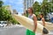 Honolulu Hawaii lifestyle surfers people walking in city with surfboards going to the beach surfing. Outside hawaiian surf living