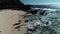 Honolulu, Hawaii, low angle view with drone camera moving forward, backlit family on the beach, color graded