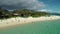 Honolulu, Hawaii, low angle view with drone camera moving horizontal, people on the shore , color graded