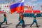 the honor guard carries the state flag of Russia. Spring sunny day. Square named after Kuibyshev. Victory Day