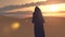 Hooded Figure in Desert